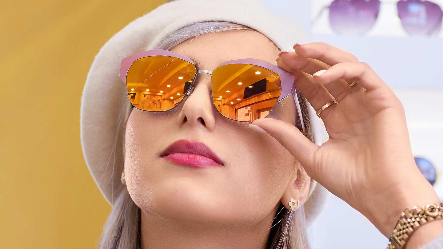 a person wearing sunglasses and a hat