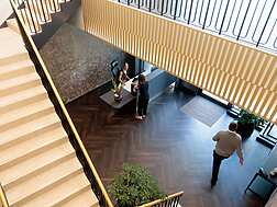 a group of people standing in a lobby