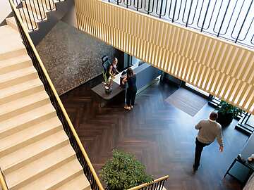 a group of people standing in a lobby