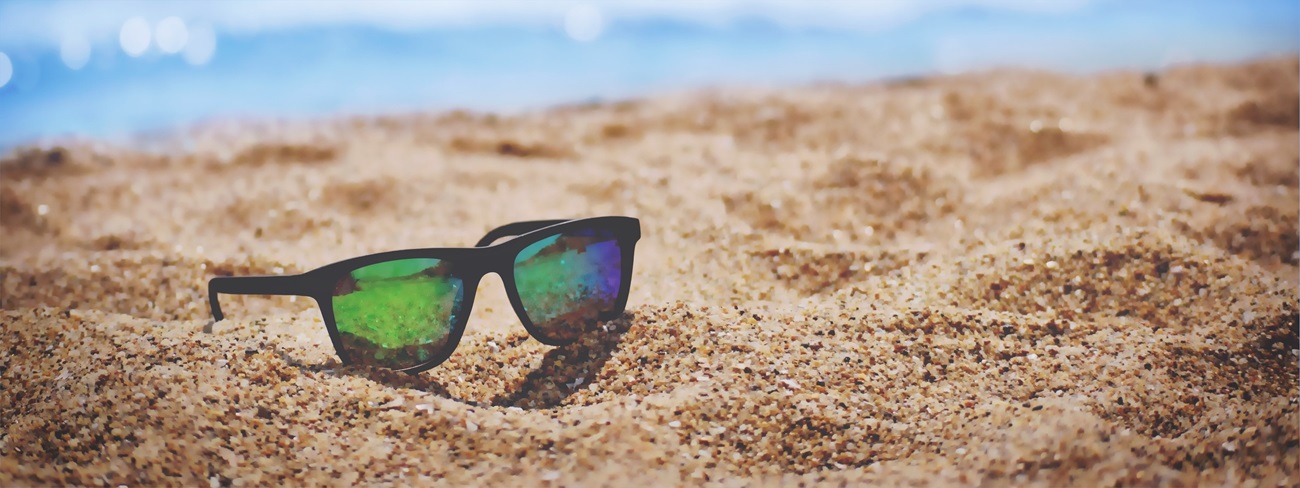 sunglasses on sand