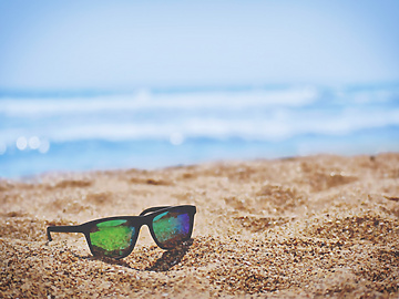 sunglasses on sand