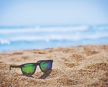 sunglasses on sand