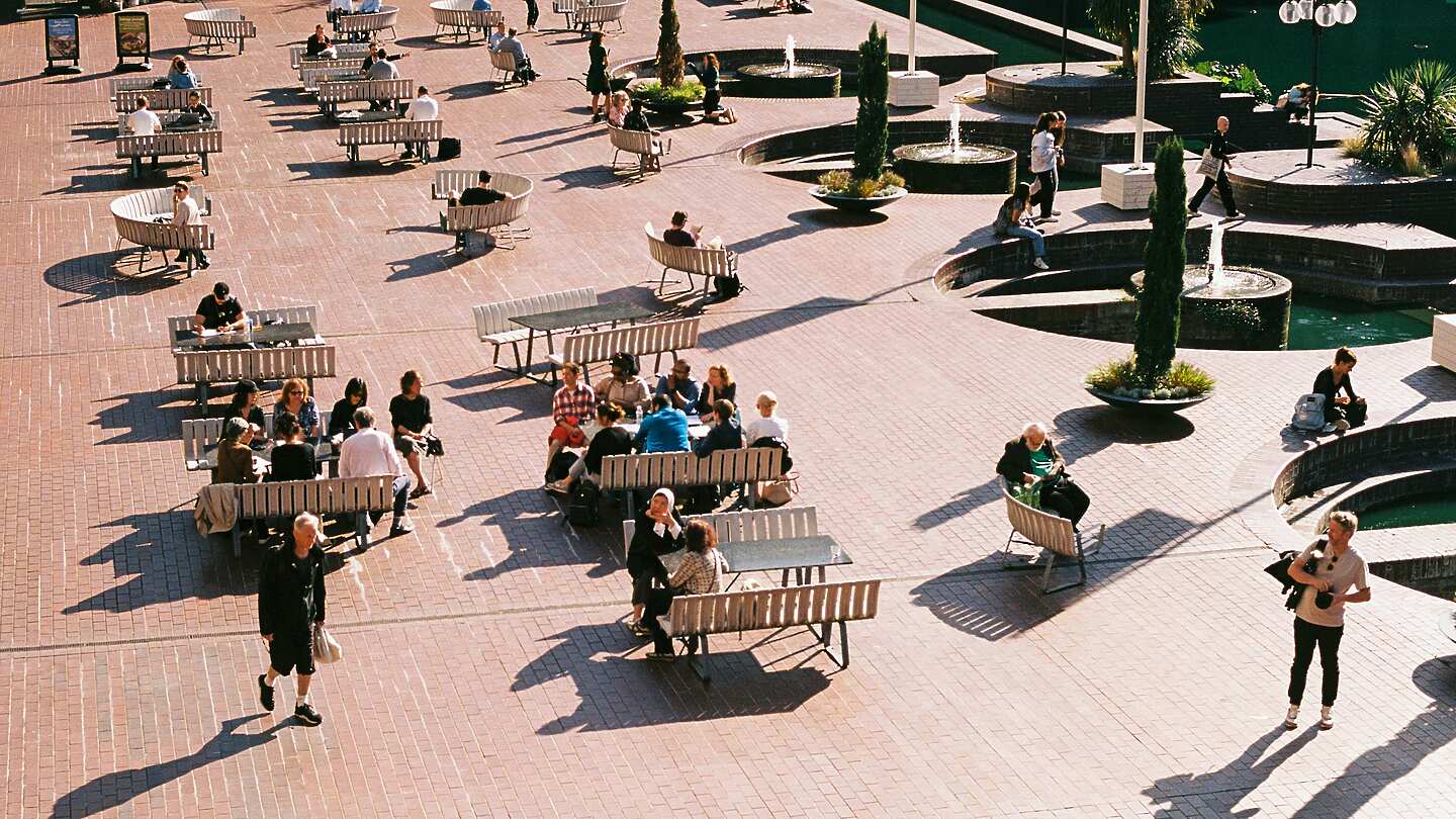 a group of people sitting on benches