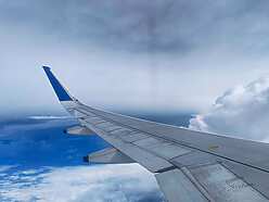 an airplane wing in the sky