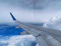 an airplane wing in the sky