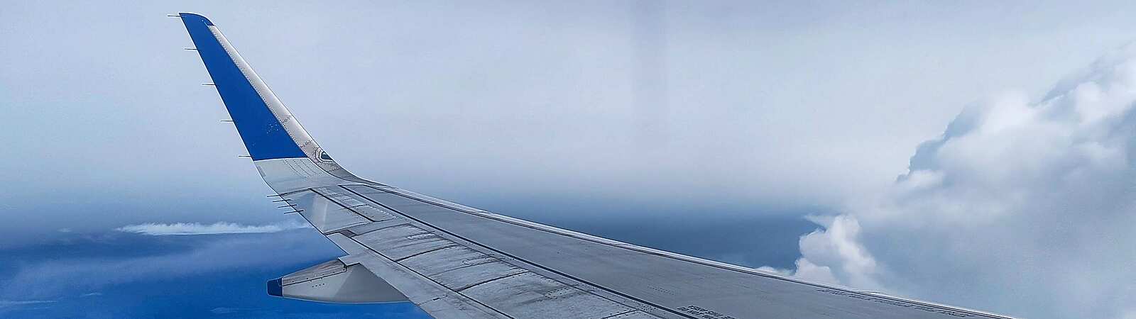 an airplane wing in the sky