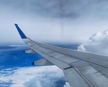an airplane wing in the sky