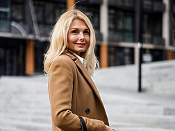 Midlife woman walking down street