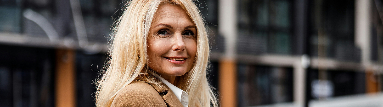 Midlife woman walking down street