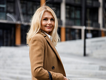 Midlife woman walking down street