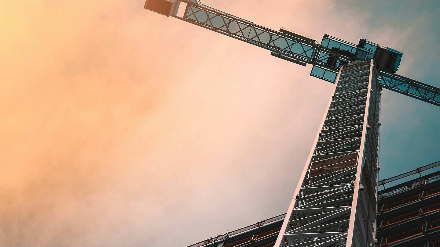 a tall crane against a blue sky