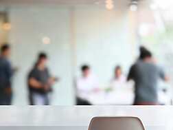 Blurred image of people in an office