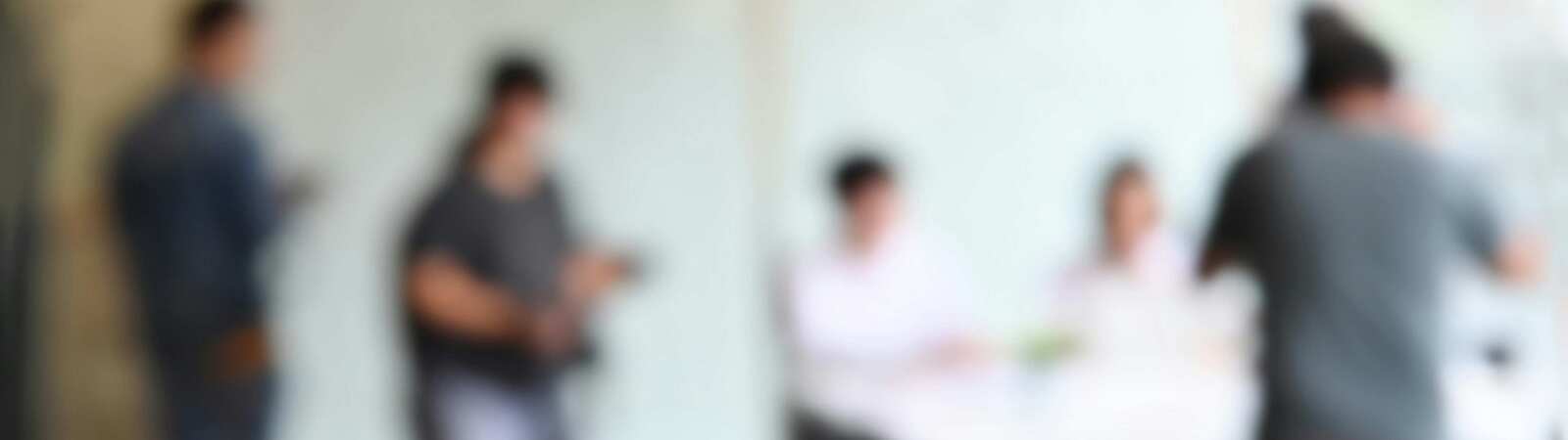 Blurred image of people in an office