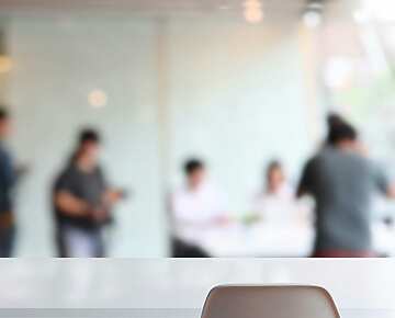 Blurred image of people in an office