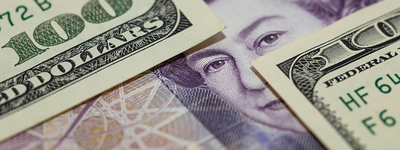 Paper notes with US dollar and UK pound currencies
