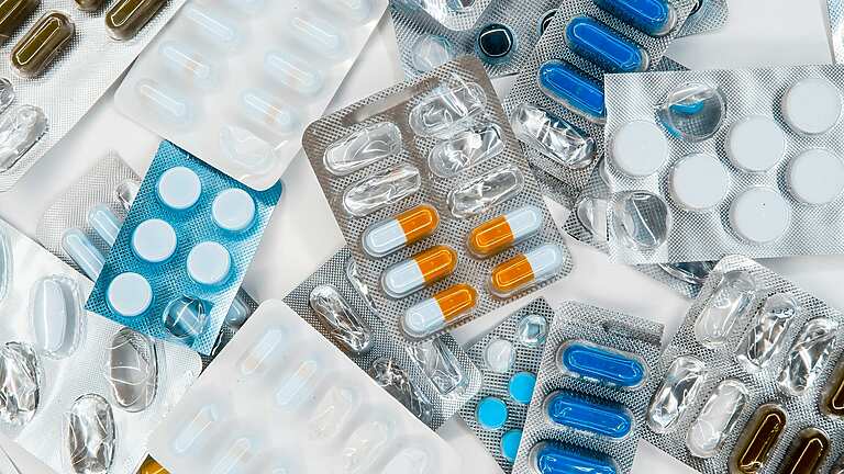 a group of pills in blisters
