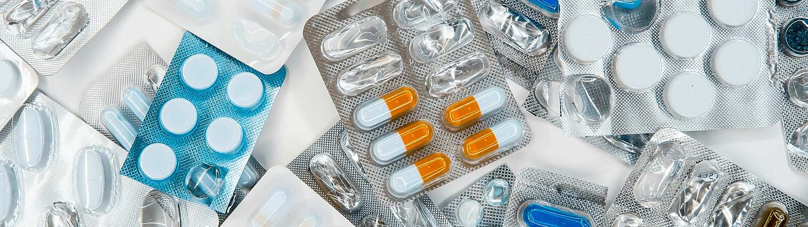 a group of pills in blisters