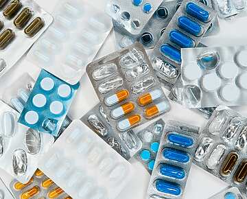 a group of pills in blisters