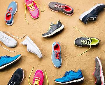a group of shoes on the sand