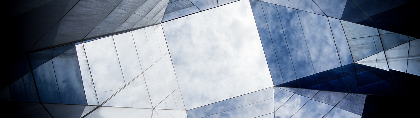 looking up at a glass building