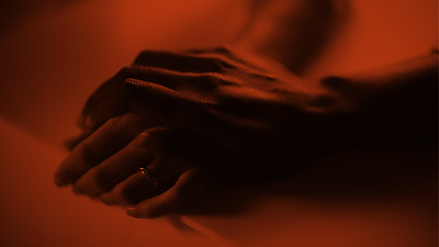 a close up of two hands holding