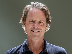 a person smiling for a picture