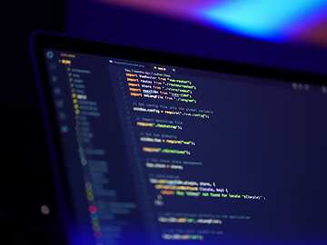 A laptop with code on the screen