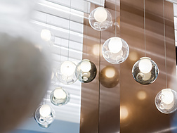 a group of glass balls from a ceiling