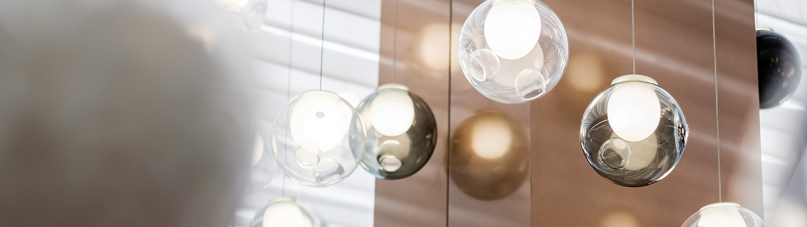 a group of glass balls from a ceiling