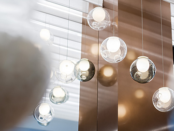 a group of glass balls from a ceiling