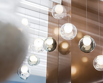 a group of glass balls from a ceiling