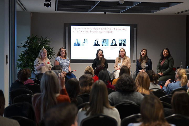 a group of women sitting in a room