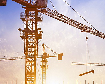 construction crane in front of sun set