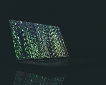 a laptop with green lights