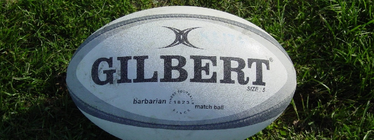 Gilbert Rugby Ball on Grass