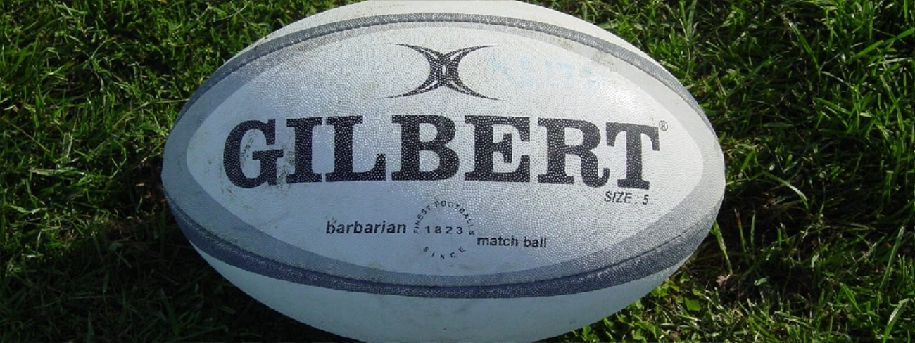 Gilbert Rugby Ball on Grass