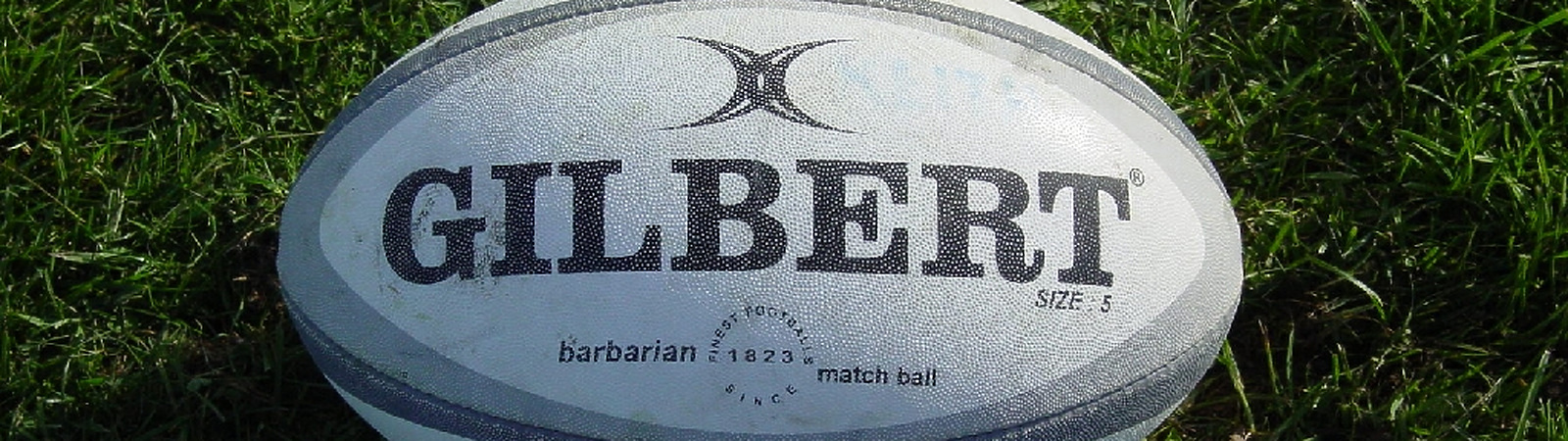 Gilbert Rugby Ball on Grass