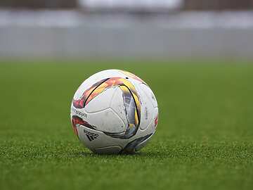 Football on green field