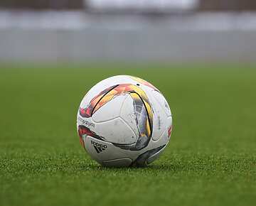 Football on green field