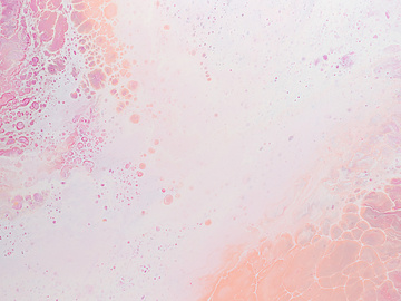 a pink and white liquid with white and pink streaks