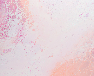 a pink and white liquid with white and pink streaks
