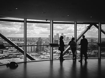 black and white photo of corporate people in office
