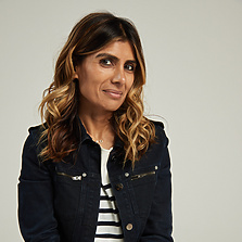 a person sitting on a stool