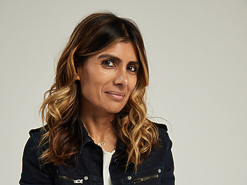 a person sitting on a stool