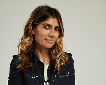 a person sitting on a stool