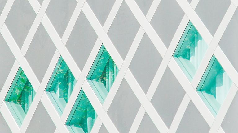 Abstract white structure with green glass