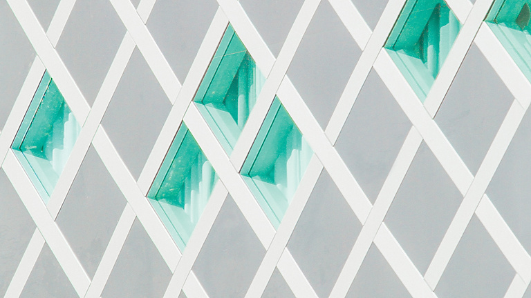 Abstract white structure with green glass