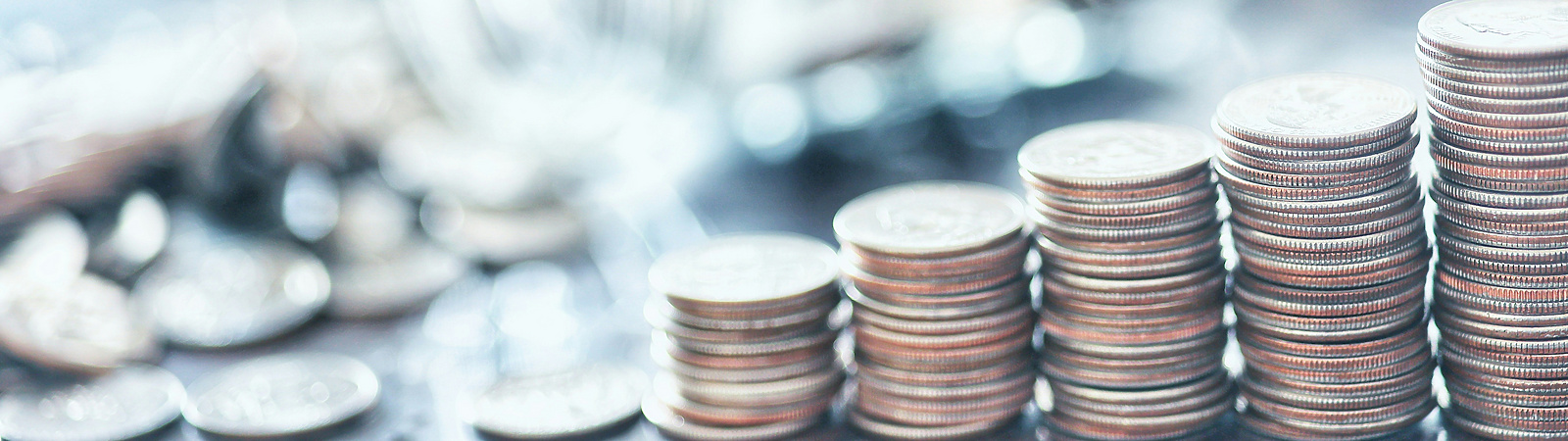 a pile of coins sitting on top on the table