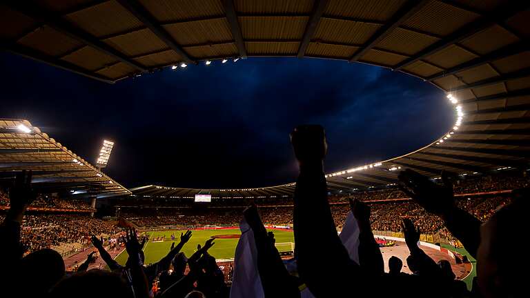 Sports crowd, cheering at the football
