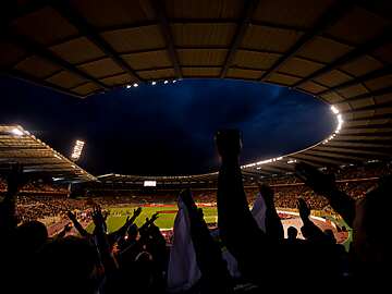 Sports crowd, cheering at the football